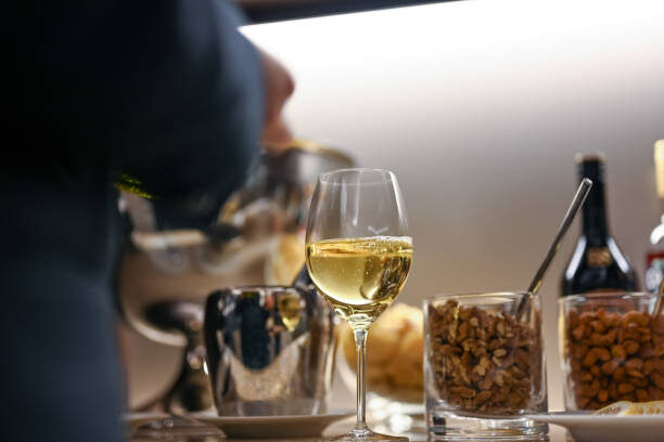 Close-up of white wine and nuts